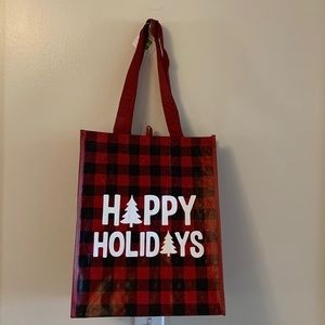 Happy Holidays shopping bag with plaid print design.
